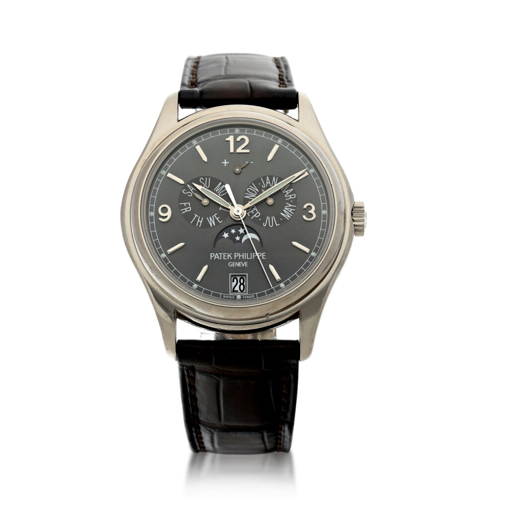 View full screen - View 1 of Lot 27. PATEK PHILIPPE | REFERENCE 5146G A WHITE GOLD AUTOMATIC ANNUAL CALENDAR WRISTWATCH WITH MOON PHASES AND POWER RESERVE, CIRCA 2013.