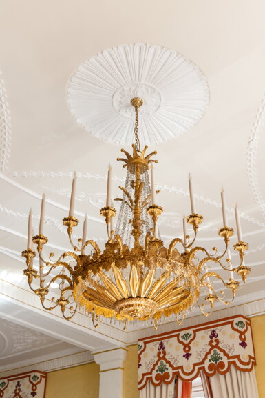 View full screen - View 1 of Lot 3. Two Austrian giltwood and cut-glass twenty-seven light chandeliers after a design by Joseph Ulrich Danhauser (1780–1829), one circa 1825, the other modern.