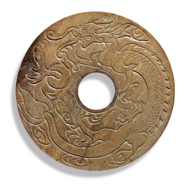 View full screen - View 1 of Lot 943. AN ARCHAISTIC LARGE BEIGE AND OLIVE-GREEN JADE 'DRAGON AND PHOENIX' DISC, LATE QING DYNASTY.