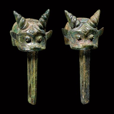 View full screen - View 1 of Lot 50. A pair of archaic bronze 'ox' linchpins Late Shang – early Western Zhou dynasty | 商晚期至西周早期 青銅牛首車轄一對.