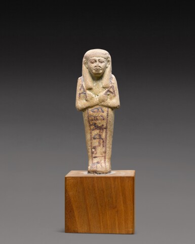 View full screen - View 1 of Lot 214. An Egyptian Faience Ushabti, 19th/20th Dynasty, 1292-1075 B.C..