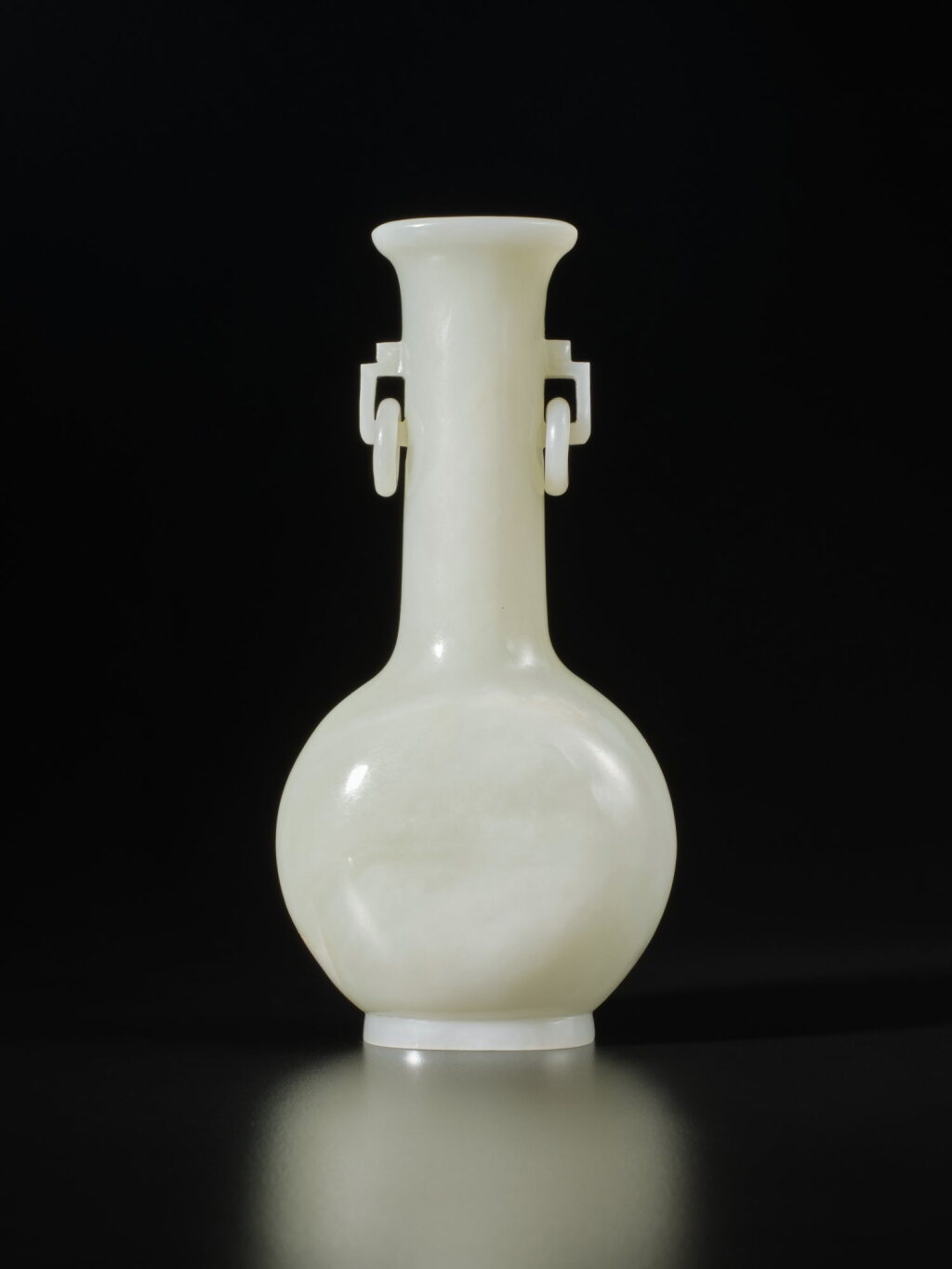 View full screen - View 1 of Lot 299. A white jade vase, 19th / 20th century | 十九 / 二十世紀 白玉雕雙耳活環長頸瓶.