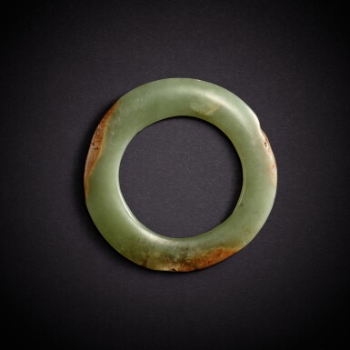 View full screen - View 1 of Lot 3462. A celadon and russet jade ring, yuan, Neolithic period, Hongshan culture | 新石器時代 紅山文化 青玉瑗.