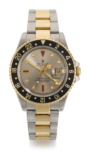View full screen - View 1 of Lot 7. ROLEX | GMT-MASTER II SULTAN, REFERENCE 16713, STAINLESS STEEL AND YELLOW GOLD DIAMOND AND RUBY-SET DUAL-TIME WRISTWATCH WITH DATE AND BRACELET, CIRCA 1998.