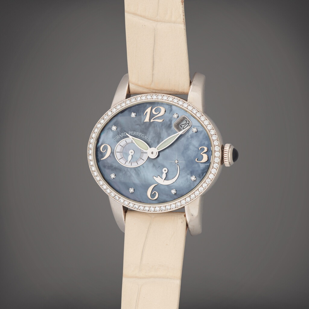 View full screen - View 1 of Lot 138. Cat's Eye, Reference 80481 | A white gold and diamond-set wristwatch with date, power reserve indication and mother-of-pearl and diamond-set dial | Circa 2007 .