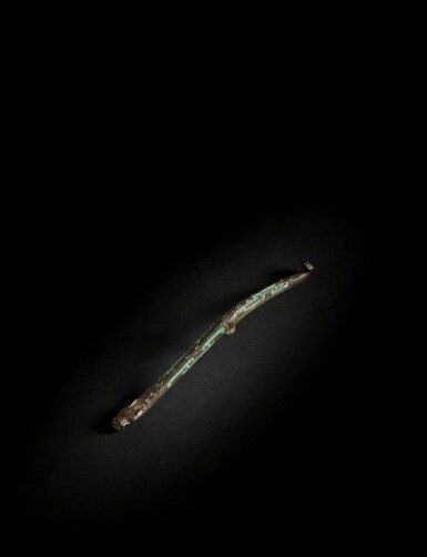 View full screen - View 1 of Lot 144. A rare inscribed turquoise-inlaid gilt-bronze belt hook, Han dynasty.