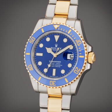 View full screen - View 1 of Lot 504. Reference 126613LB Submariner | A yellow gold and stainless steel automatic wristwatch with date and bracelet, Circa 2021.