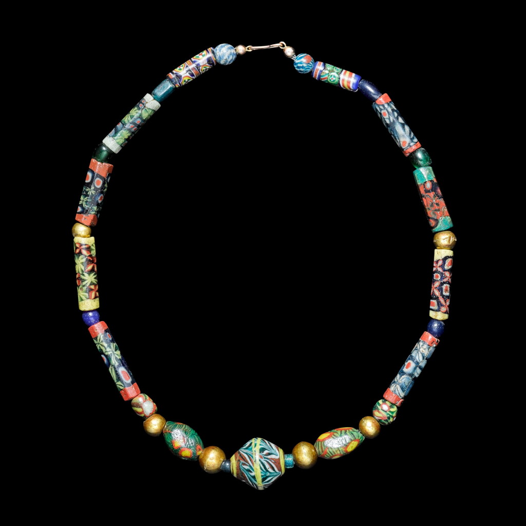 View full screen - View 1 of Lot 143. A Romano-Egyptian Group of Millefiori and Mosaic Glass Beads, circa 1st Century B.C./4th Century A.D..
