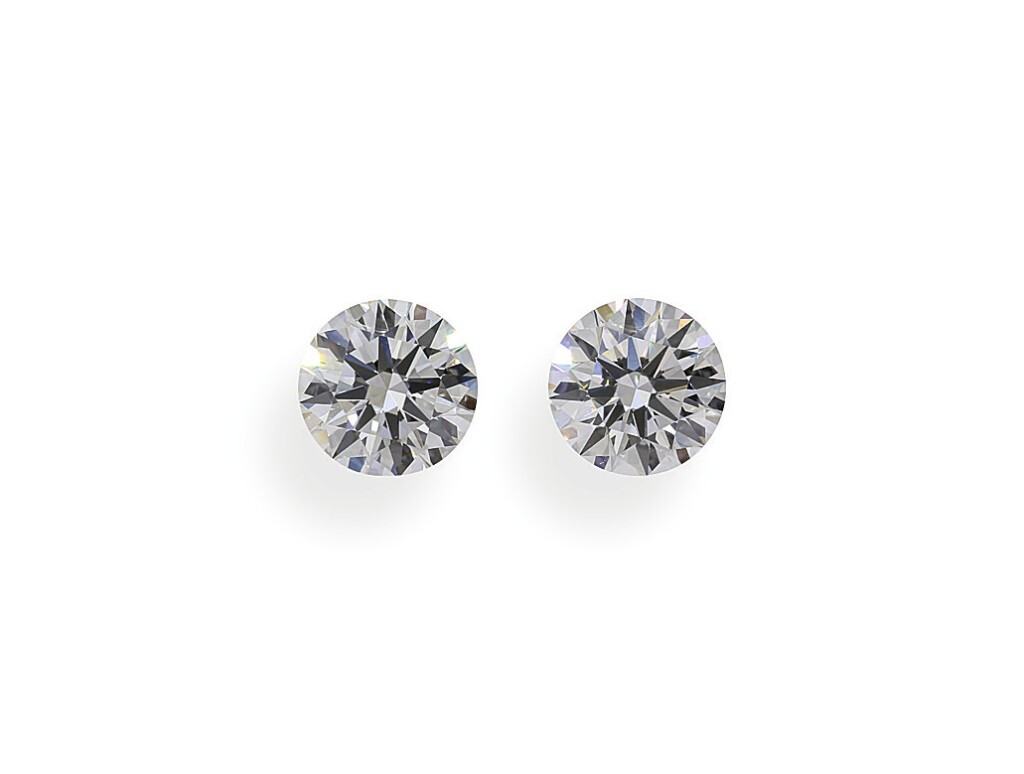 View full screen - View 1 of Lot 14. A Pair of 0.52 Carat Round Diamonds, F Color, VVS2 and VS1 Clarity.