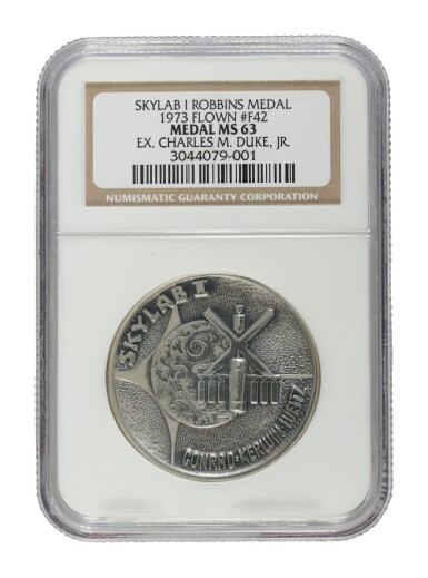 View full screen - View 1 of Lot 214. FLOWN ON SKYLAB I (SL-2). APOLLO ASTRONAUT CHARLES DUKE'S SKYLAB I SILVER ROBBINS MEDALLION.