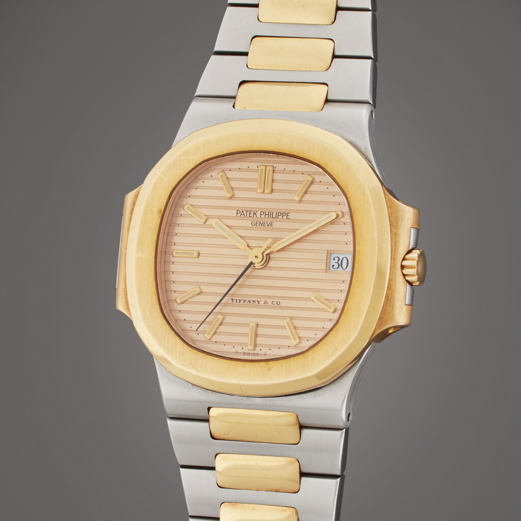 View full screen - View 1 of Lot 183. Reference 3800/1 Nautilus | Retailed by Tiffany & Co.: A yellow gold and stainless steel wristwatch with date and bracelet, Made in 1993.