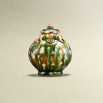 A small sancai-glazed 'floral' jar, Tang dynasty | 唐 三彩貼花四繫蓋罐