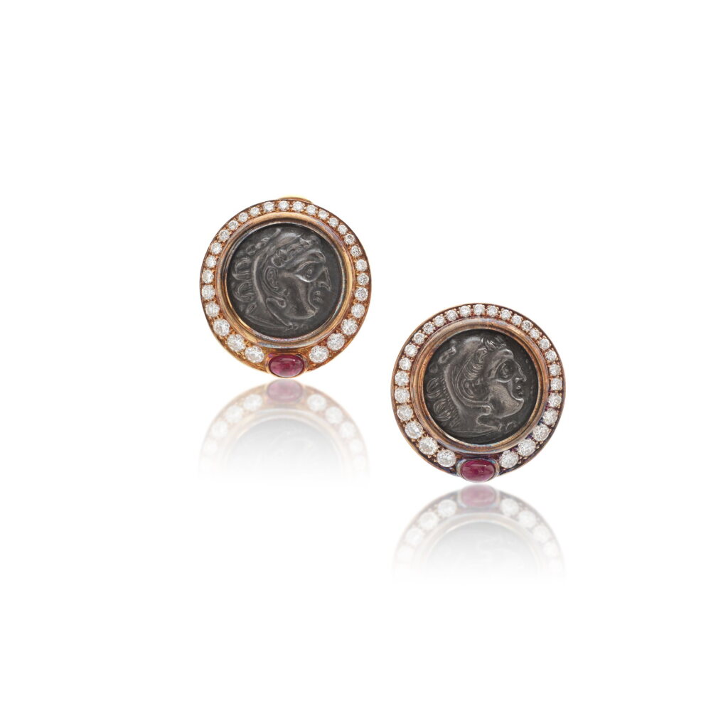 View full screen - View 1 of Lot 718. Pair of ancient coin, ruby and diamond ear clips, 'Monete'.