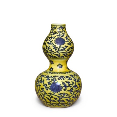 View full screen - View 1 of Lot 83. A yellow-ground underglaze-blue 'double-gourd' vase, Mark and period of Jiajing | 明嘉靖 黃地青花纏枝蓮紋葫蘆瓶 《大明嘉靖年製》款.