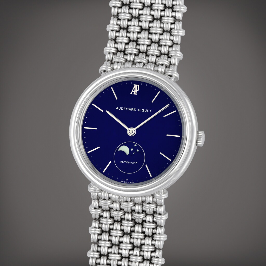 View full screen - View 1 of Lot 380. A white gold bracelet watch with moon phases and integrated bracelet | Circa 1985.