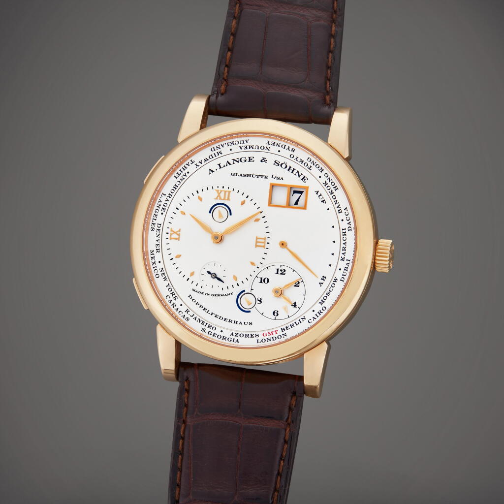 View full screen - View 1 of Lot 57. Reference 116.032 Lange 1 Time Zone | A pink gold world time wristwatch with date and power reserve indication, Circa 2007.