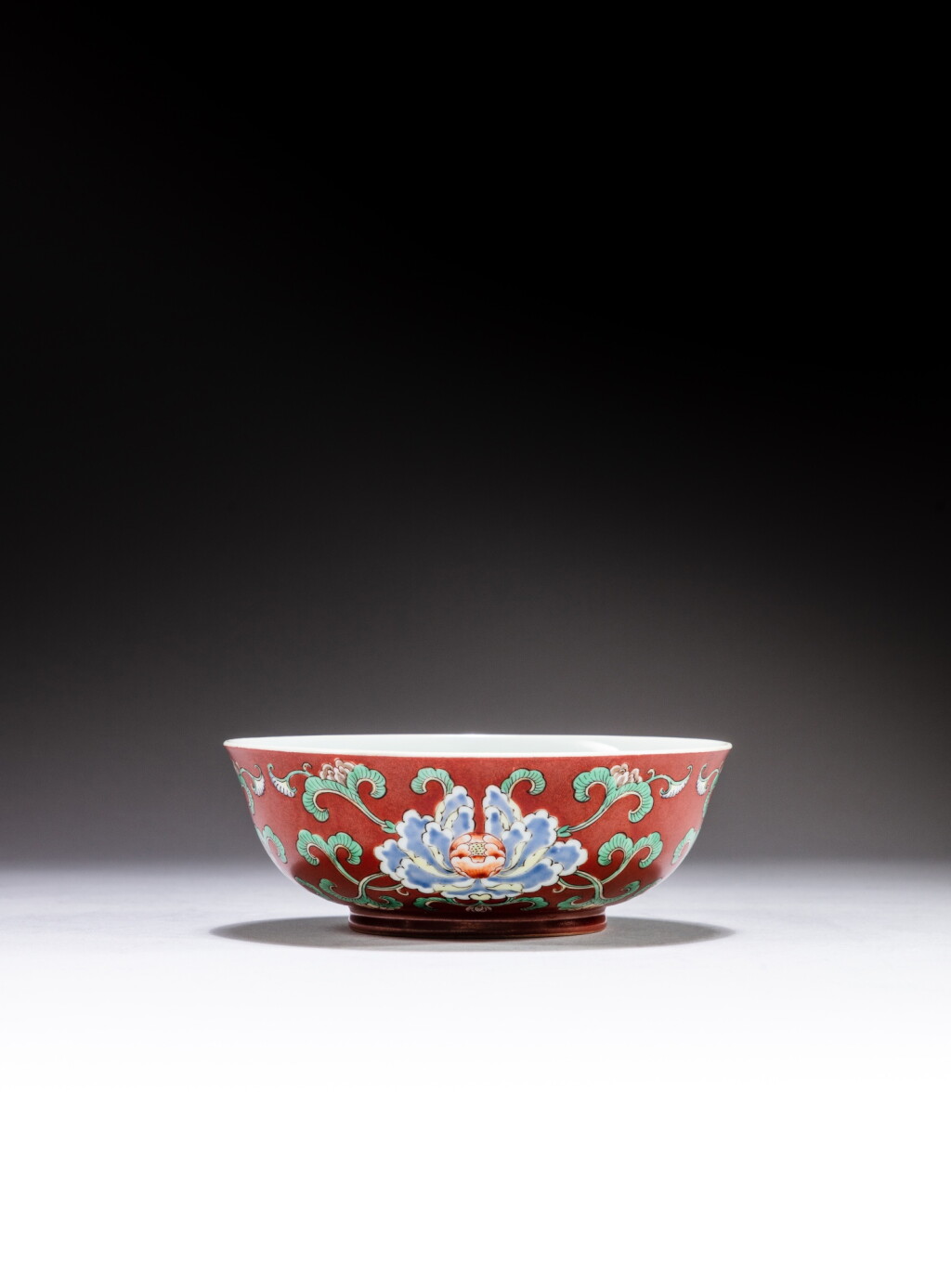 View full screen - View 1 of Lot 125. A coral-ground famille-verte ‘peony’ bowl, Yuzhi, mark and period of Yongzheng | 清雍正 珊瑚紅地五彩牡丹紋盌 《雍正御製》款.