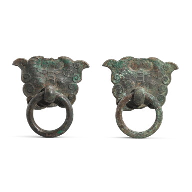 View full screen - View 1 of Lot 1074. A pair of bronze 'buffalo mask' door knockers, Han dynasty | 漢 青銅牛面鋪首.