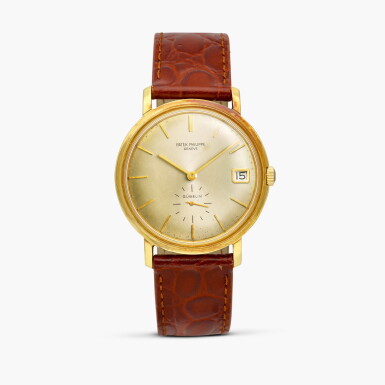 View full screen - View 1 of Lot 2369. Calatrava, Reference 3445 | A yellow gold wristwatch with date, Retailed by Gübelin, Made in 1963.