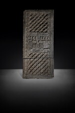 An impressed gray pottery 'mask' tomb tile, Western Han dynasty