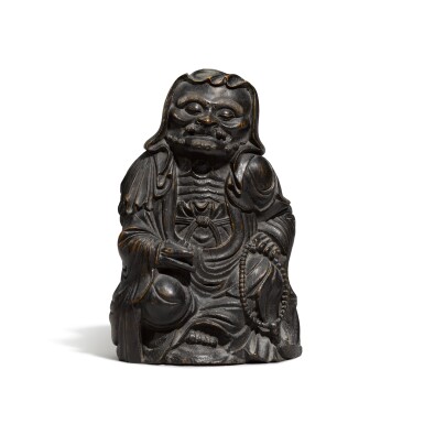View full screen - View 1 of Lot 191. A bamboo carving of a seated monk, Qing dynasty, 18th century | 清十八世紀 竹雕羅漢坐像.