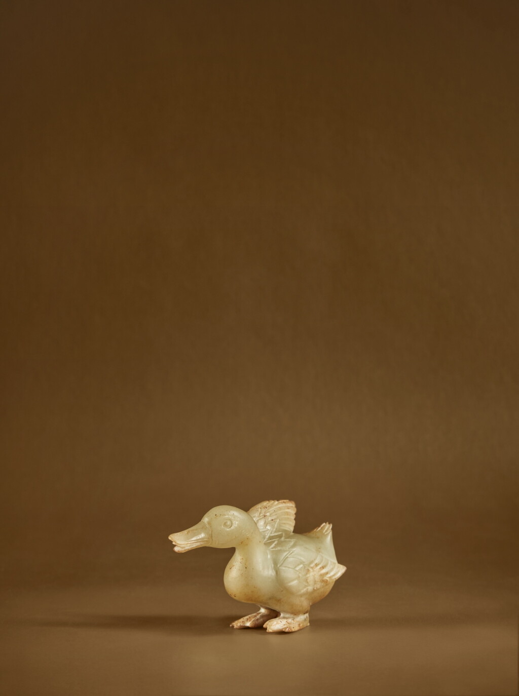 View full screen - View 1 of Lot 130. A rare pale green jade carving of a goose, Song - Yuan dynasty .