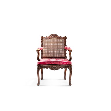 View full screen - View 1 of Lot 153. A Louis XV tinted beechwood caned fauteuil, circa 1730-1740 .