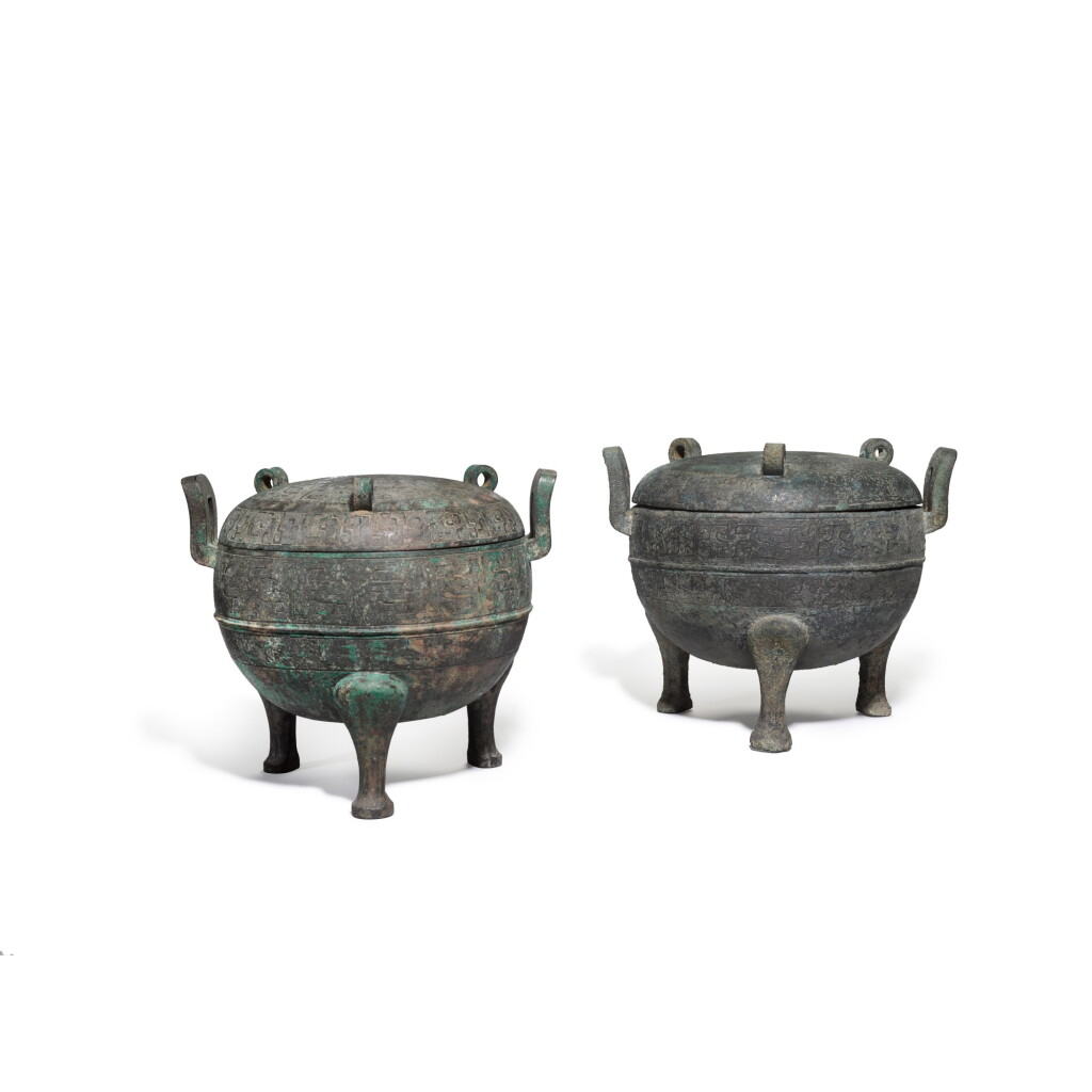 View full screen - View 1 of Lot 101. Two archaic bronze ritual tripod food vessels and covers, Ding, Warring States period | 戰國 青銅三足蓋鼎一組兩件.