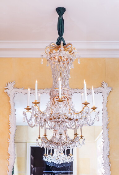 View full screen - View 1 of Lot 26. A pair of eight-light gilt-metal and glass chandeliers, by maison Delisle and commissioned by Jacques Grange, late 20th century.