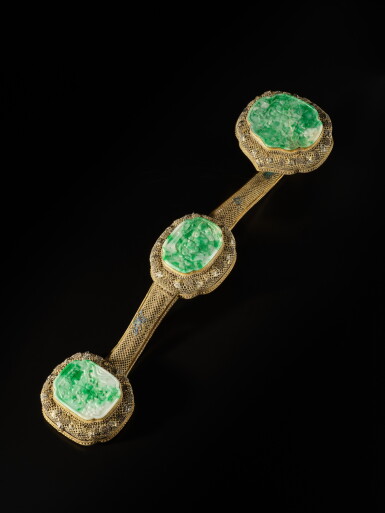 View full screen - View 1 of Lot 611. A jadeite-inlaid and champlevé-enameled gilt-silver filigree ruyi scepter, Qing dynasty, Guangxu period | 清光緒 銀鎏金鏤空纍絲鑲翠玉如意.