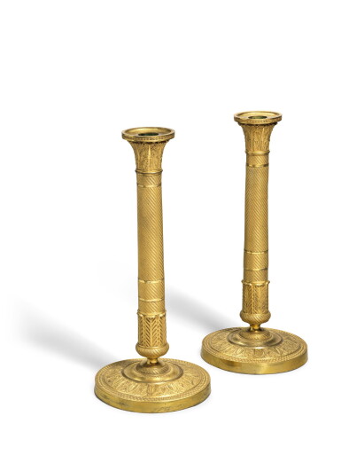 View full screen - View 1 of Lot 94. A pair of Empire gilt-bronze candlesticks, circa 1815.