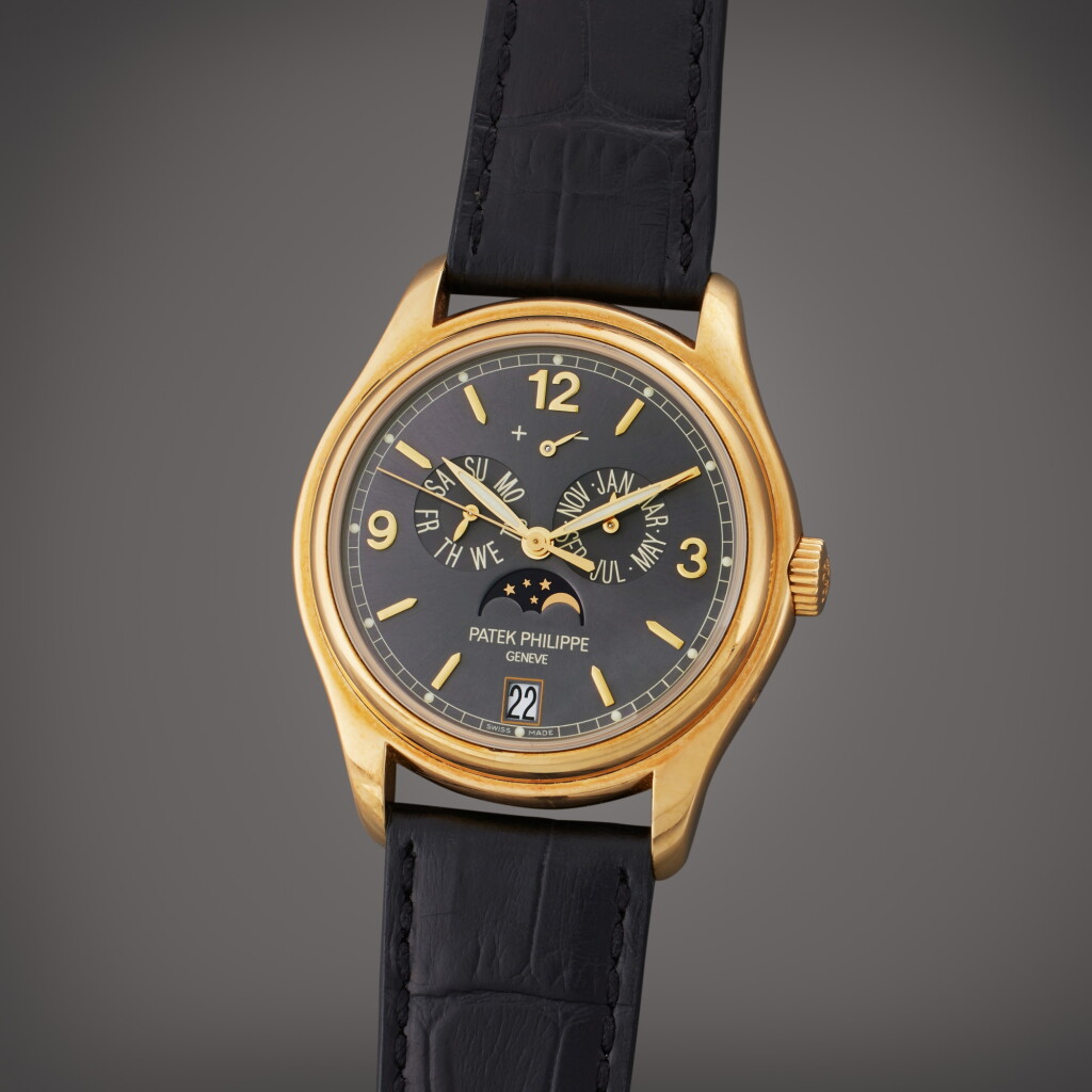 View full screen - View 1 of Lot 357. Reference 5146J-010 | A yellow gold automatic annual calendar wristwatch with moon phases and power reserve indication, Circa 2010.