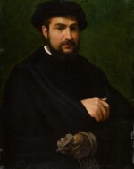 Portrait of a bearded man holding a glove