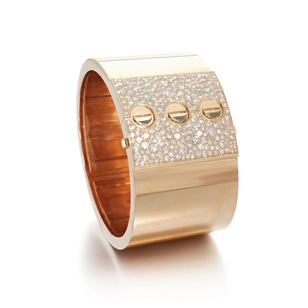 View full screen - View 1 of Lot 516. Gold and diamond bangle, 'Love'.