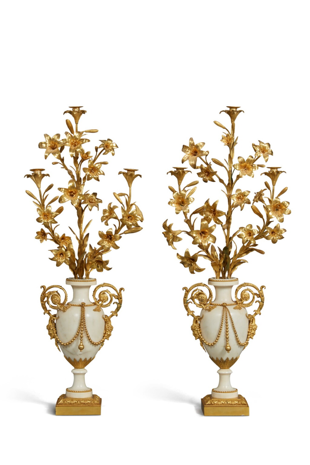 View full screen - View 1 of Lot 93. A Pair of Gilt Bronze and White Marble Three-Light Lily Branch Candelabra, Late 18th/Early 19th Century.