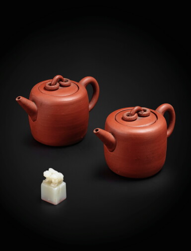 View full screen - View 1 of Lot 152. A small white jade seal and two Yixing barrel-shaped teapot and cover Qing dynasty, 19th century | 清十九世紀 青白玉印章及宜興紫砂茶壺一組三件.