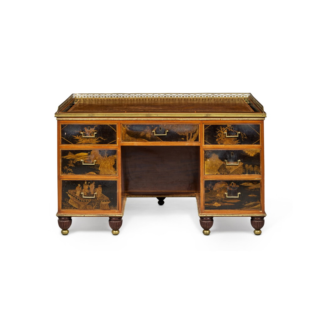 View full screen - View 1 of Lot 66. A Regency Brass-Mounted Gilt and Black Japanned Satinwood-Inlaid Mahogany Pedestal Desk, Circa 1810.