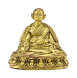 A GILT-BRONZE FIGURE OF A LAMA, TIBET, 18TH CENTURY | 十八世紀 藏傳鎏金銅喇嘛坐像