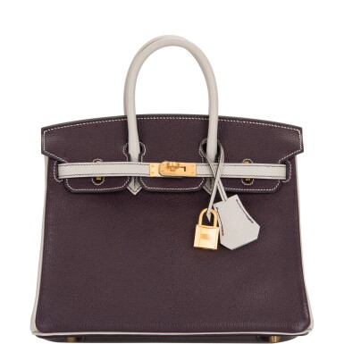 View full screen - View 1 of Lot 17. Hermès Horseshoe Stamp (HSS) Bi-color Raisin and Gris Perle Birkin 25cm of Chevre Leather with Gold Hardware.