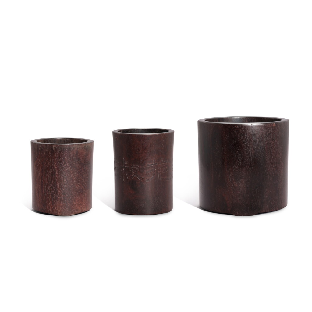 View full screen - View 1 of Lot 3649. Three zitan brushpots, Qing dynasty, 19th century | 清十九世紀 紫檀筆筒三件.