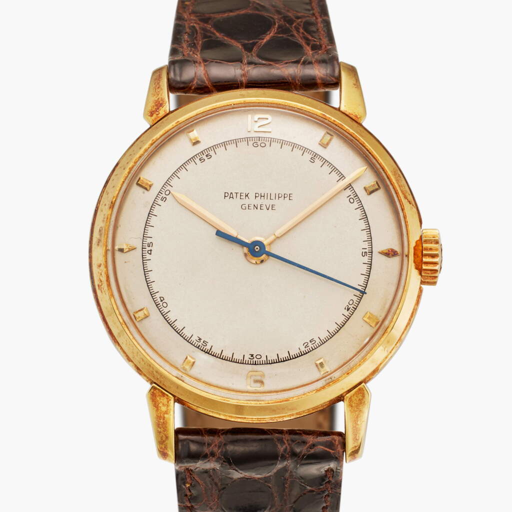 View full screen - View 1 of Lot 21. Reference 2482 | A yellow gold wristwatch with two-tone dial, Made in 1952.