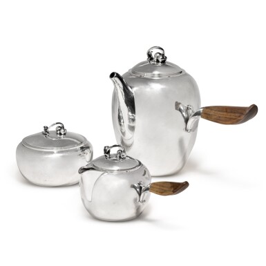 View full screen - View 1 of Lot 120. A three-piece Danish silver coffee set, No. 875, Georg Jensen Silversmithy, Copenhagen, circa 1945-77.