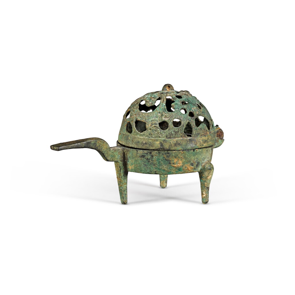 View full screen - View 1 of Lot 6. A small bronze lamp with a hinged openwork cover Han dynasty | 漢 青銅燈.