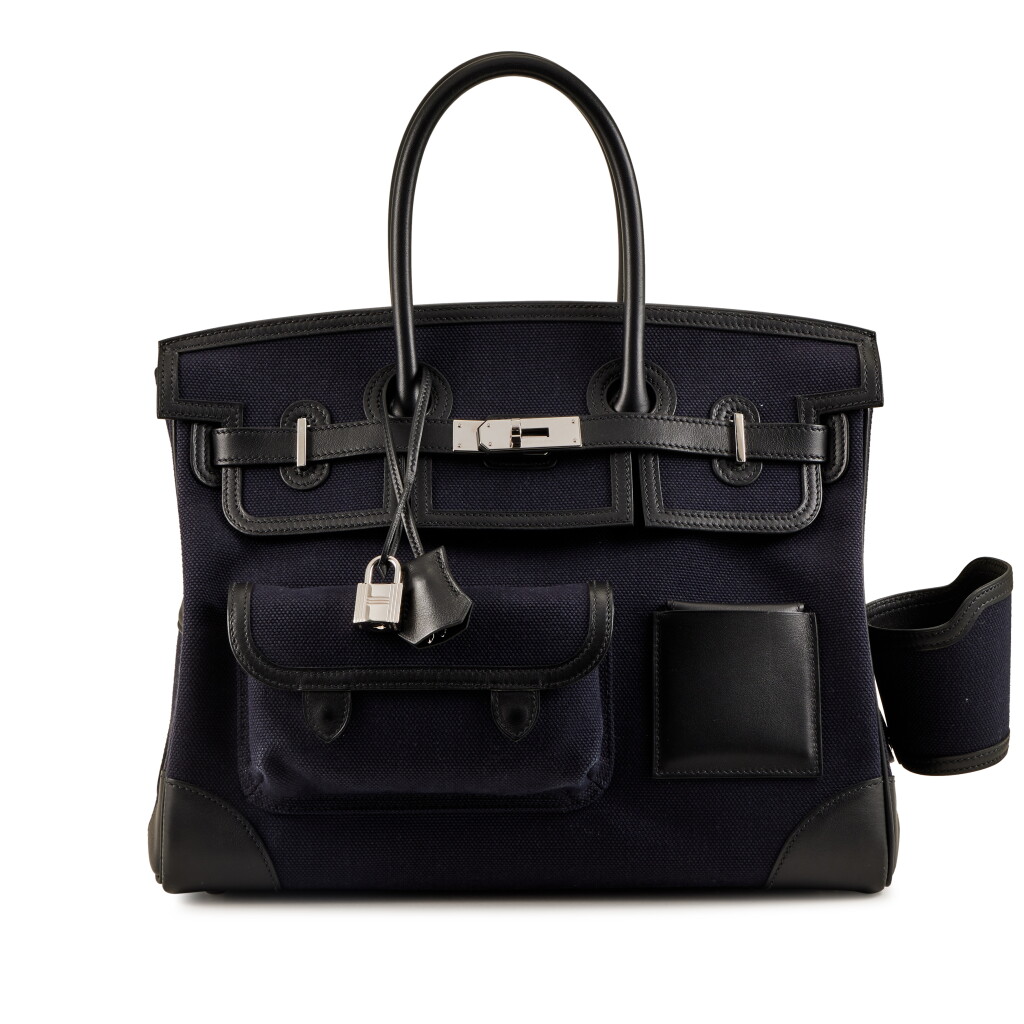 View full screen - View 1 of Lot 88. Limited Edition Black Swift and Bleu Nuit Toile Cargo Birkin 35 Palladium Hardware, 2021.