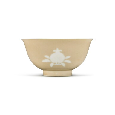 View full screen - View 1 of Lot 507. A fine and rare reserve-decorated café-au-lait 'sanduo' bowl, Mark and period of Yongzheng | 清雍正 米黃地堆白三多紋盌 《大清雍正年製》款.