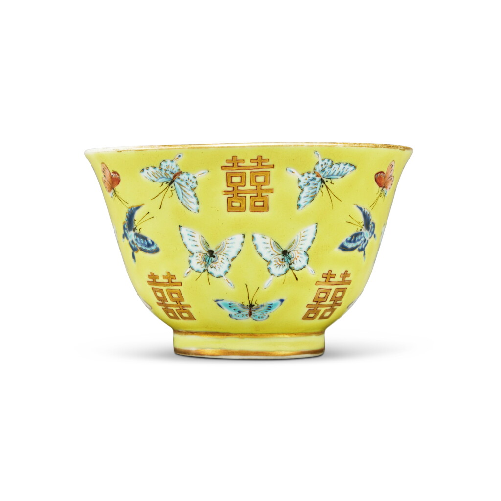 View full screen - View 1 of Lot 1024. A yellow-ground famille-rose 'butterfly and shuangxi' cup, Mark and period of Tongzhi | 清同治 黃地粉彩百蝶雙喜紋盃 《同治年製》款.