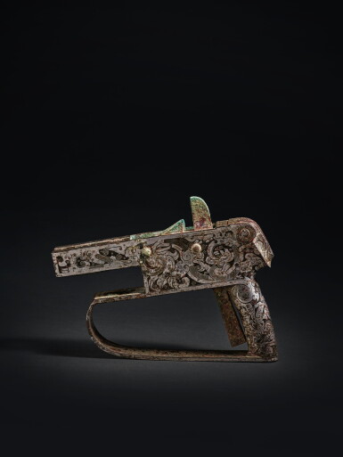 View full screen - View 1 of Lot 215. A magnificent and exceptionally rare silver-inlaid bronze crossbow casing and trigger, Late Warring States period - Han dynasty | 戰國末至漢 銅錯銀螭龍紋弩郭連弩機.