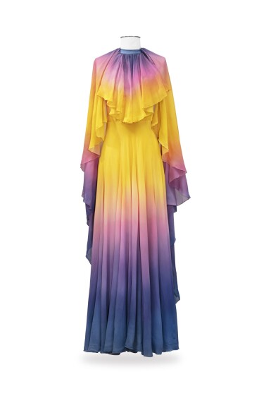 View full screen - View 1 of Lot 10. Balestra, 1972, Sunbathing dress with pleated collar and matching cape | Robe longue bain de soleil à collerette plissée en mousseline avec cape assortie.