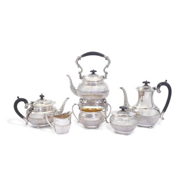 View full screen - View 1 of Lot 137. A six piece silver tea service , William Adams Ltd., Birmingham, 1933/34; and a Victorian silver two-handled tray, London, 1875.