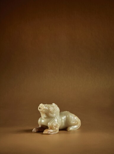 View full screen - View 1 of Lot 93. A pale celadon jade carving of a mythical beast (Bixie), Six Dynasties.